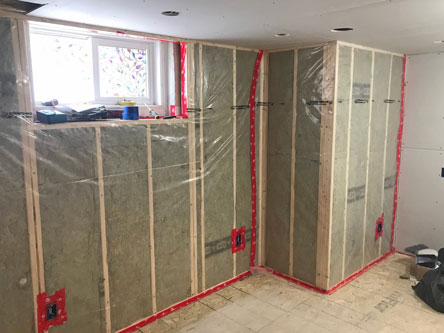Installation of insulation and drywall and taping